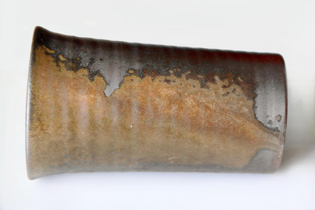Side view of a Bizen-yaki mug featuring natural ash glaze and earthy brown tones.