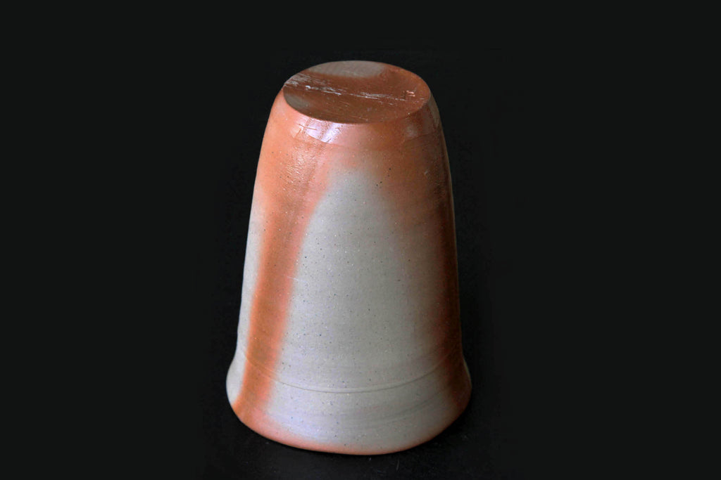 Bizen ware cup viewed upside-down showing the curved body and natural firing marks