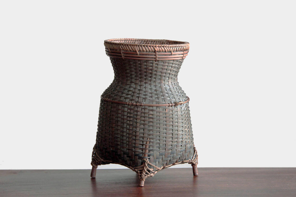 Hand woven bamboo basket or flower vase. Japanese craft