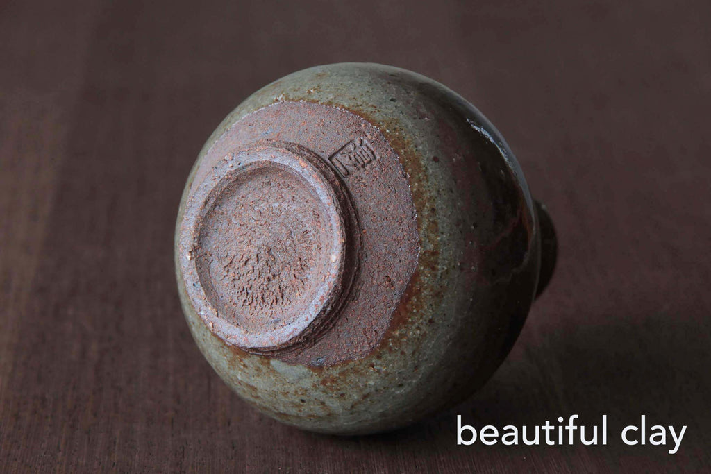 Japanese Sake bottle by a noted potter. Bottom side. Beautiful clay.