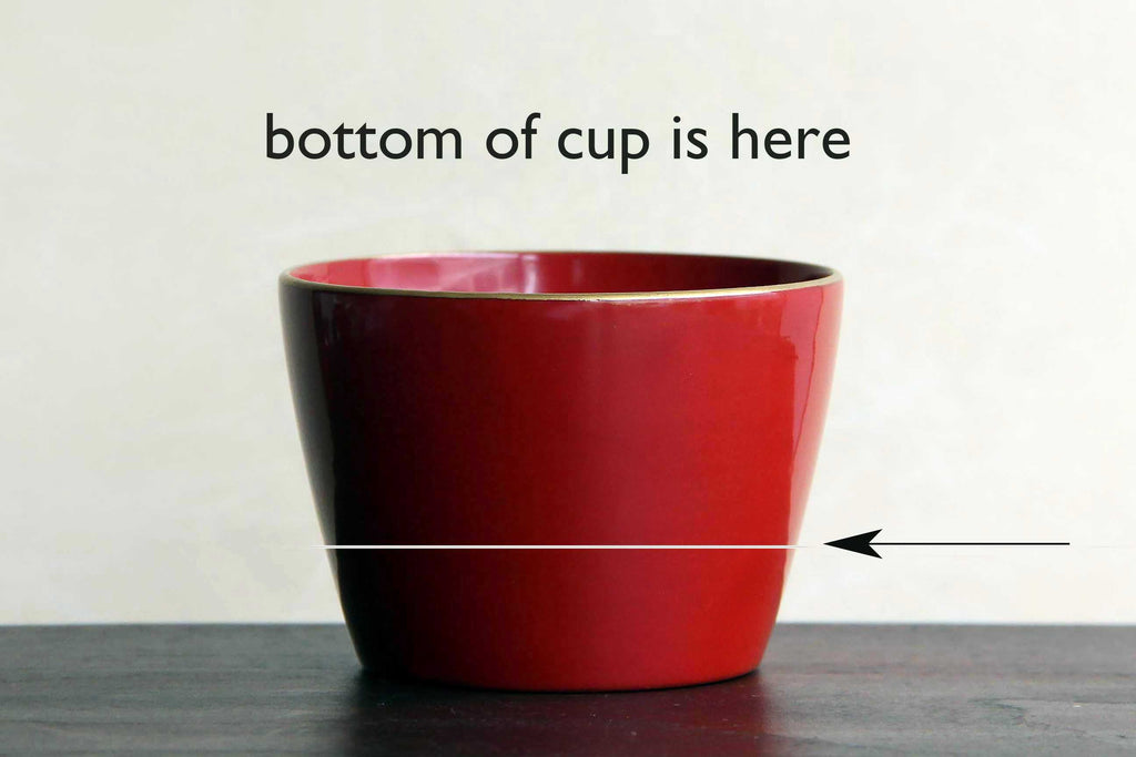 red wooden tea cup