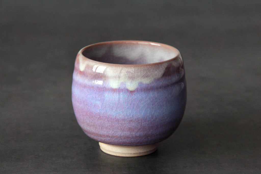 Single Hagi ware yunomi cup with a rounded form and layered pink-purple glaze