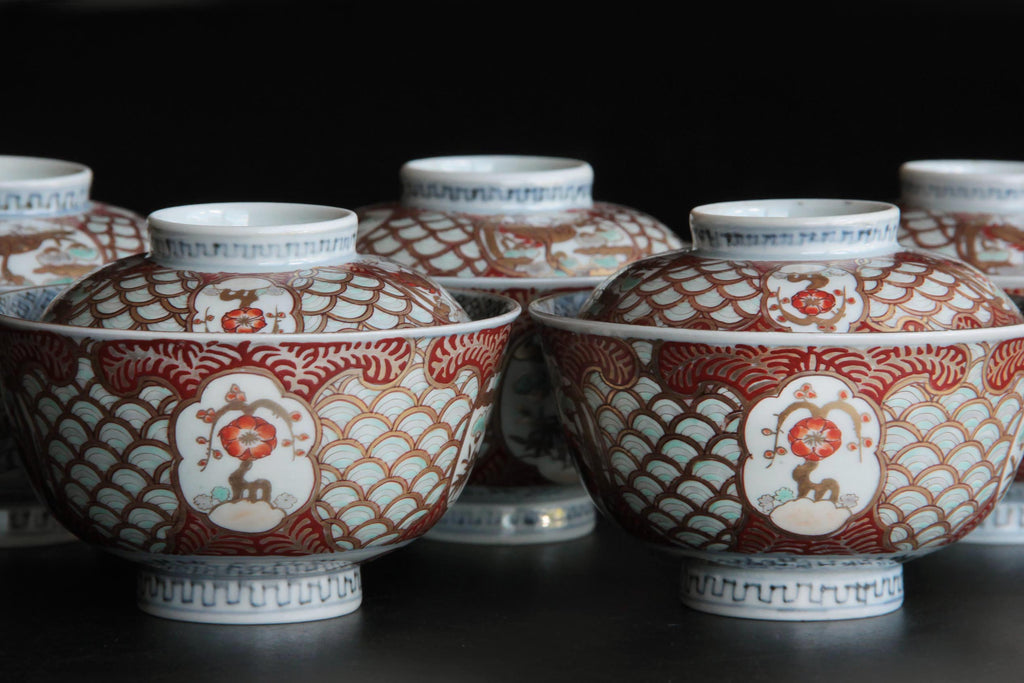 Five Ko-Imari bowls neatly arranged with lids on