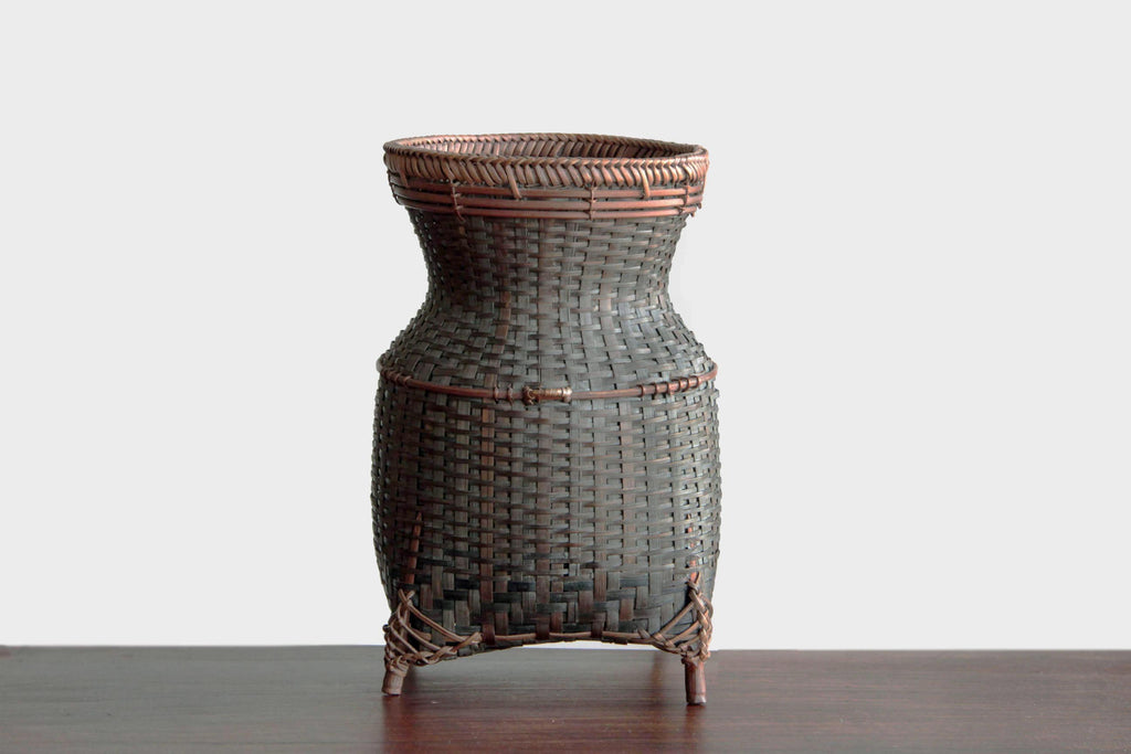 Hand woven bamboo basket or flower vase. Japanese craft