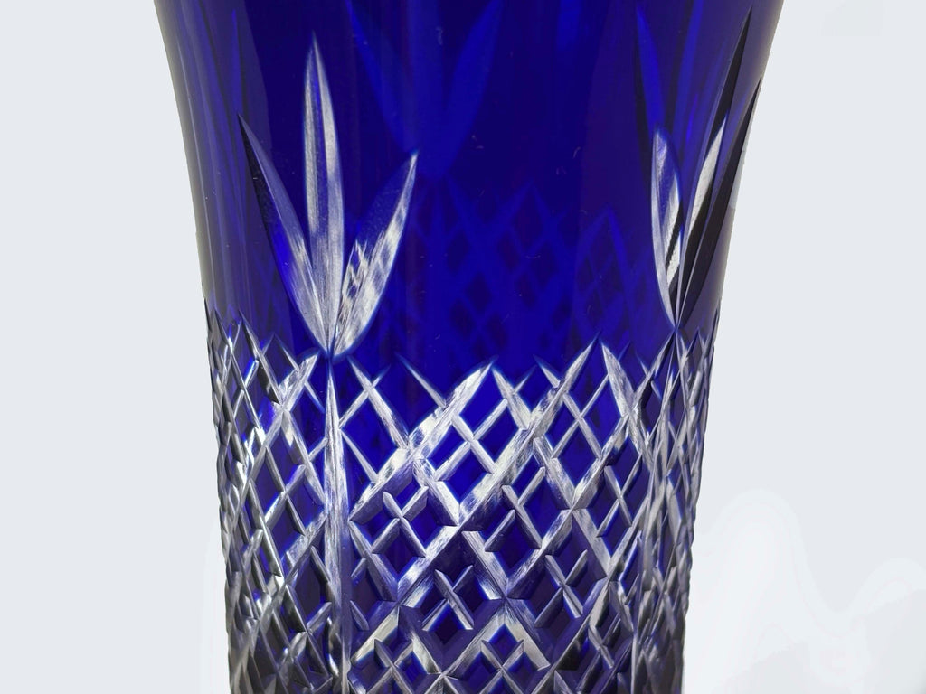 Detailed view of bamboo and lattice cuts on a cobalt blue Edo Kiriko glass.