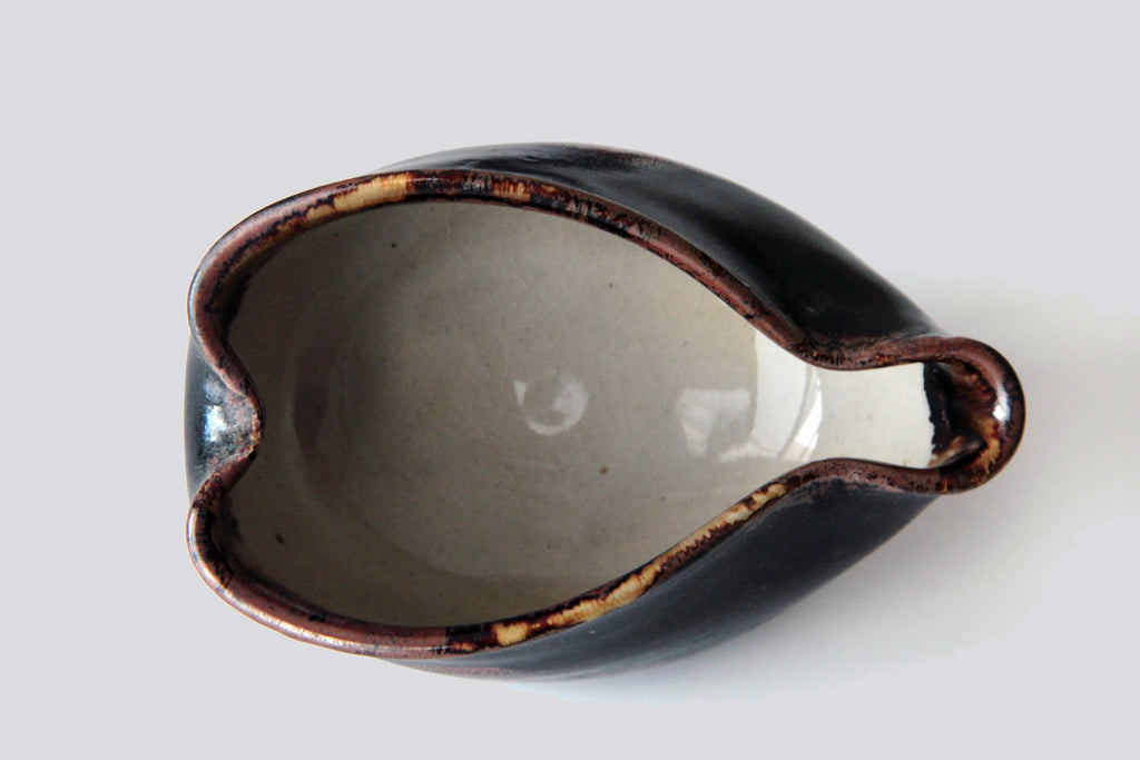 Top view of the yuzamashi showing its white glazed interior and curved rim