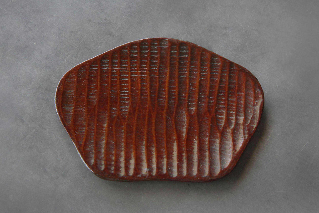 hand-carved wooden plate. Japanese craft. 