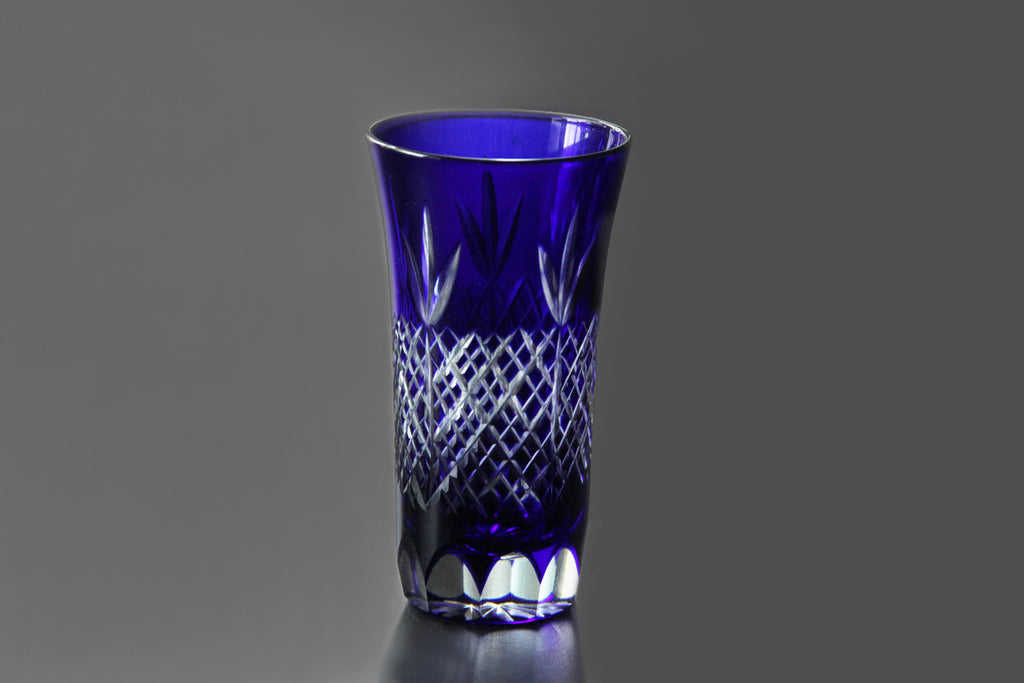 Studio-shot of Edo Kiriko glass with a subtle light reflection highlighting its cut details.