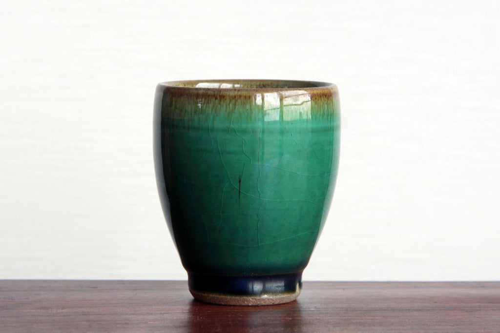 Glass-like green glaze tea cup.