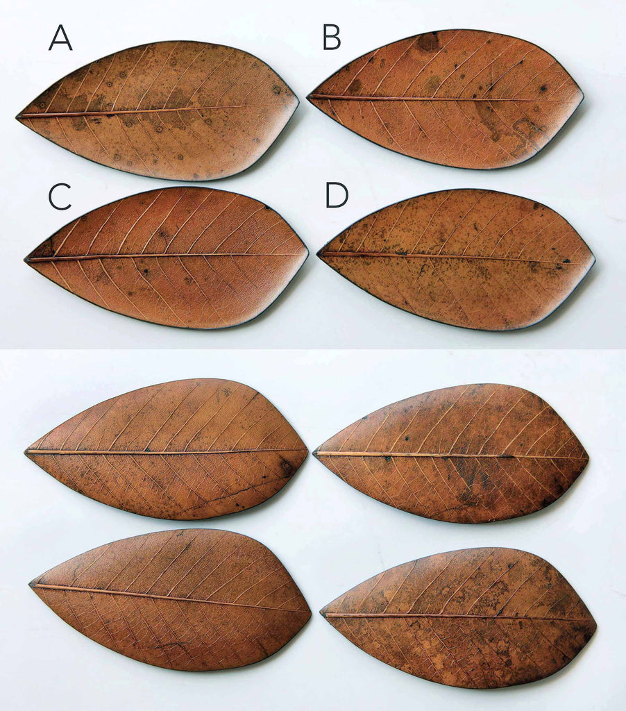 Top-down view of multiple handcrafted plates made from real leaves, labeled A–D, highlighting natural veins and textures.