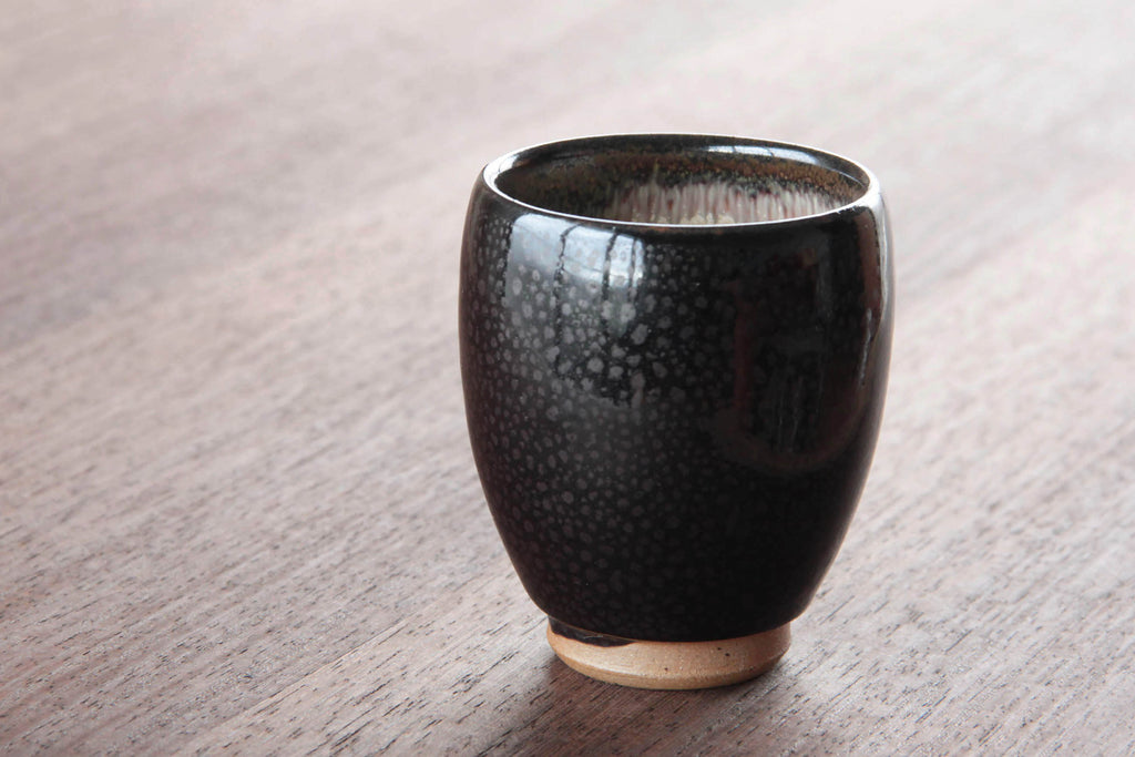 Black glaze tea cup by Otaru kiln in Hokkaido. 