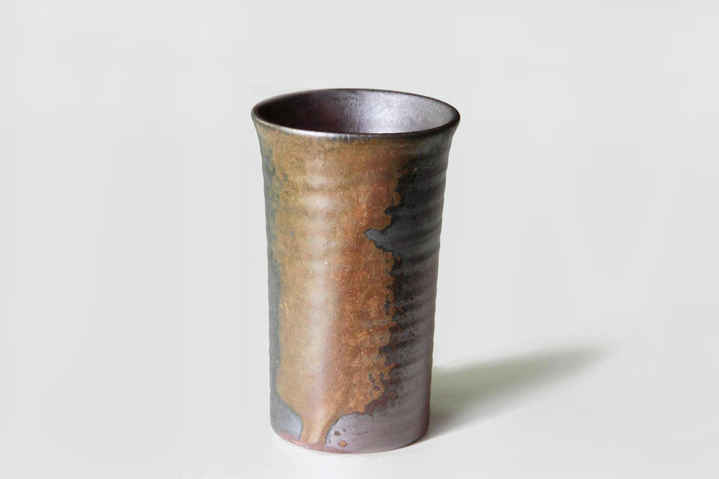 Elegant tall Bizen pottery cup with a naturally formed flowing glaze pattern.