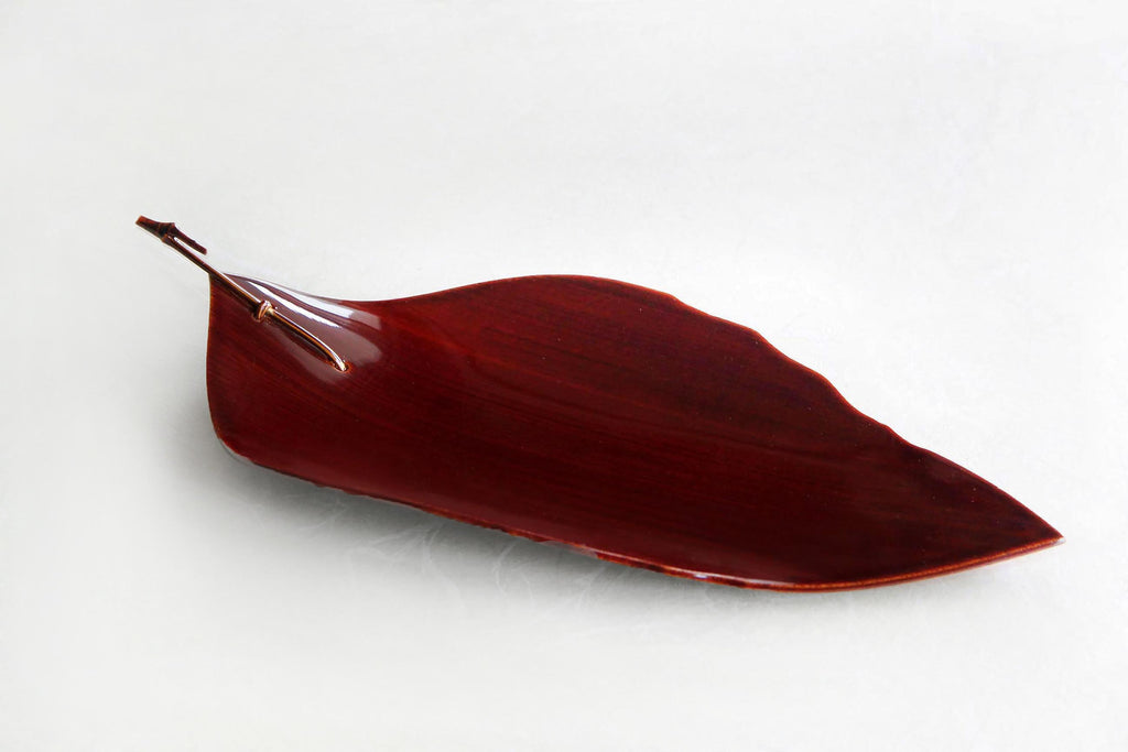 Japanese Hida Shunkei lacquerware plate in the shape of a leaf, used for wagashi or tea ceremony