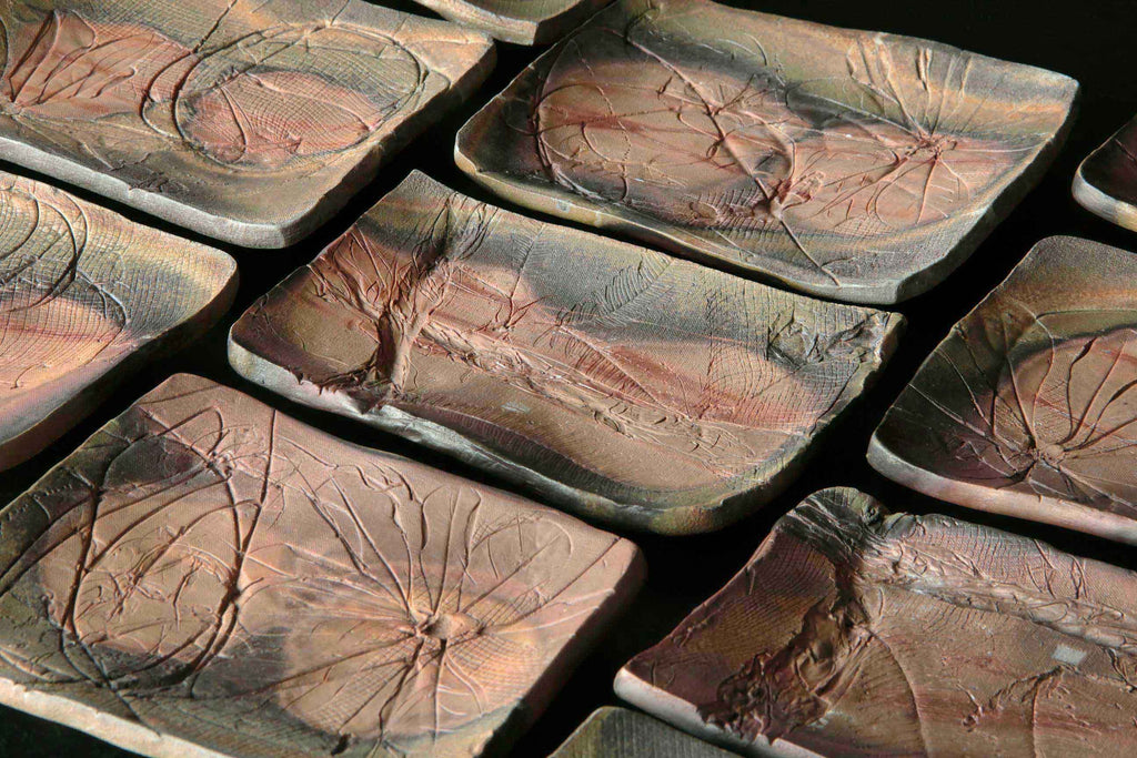 Thick and heavy ceramic dish. Japanese Bizen pottery.