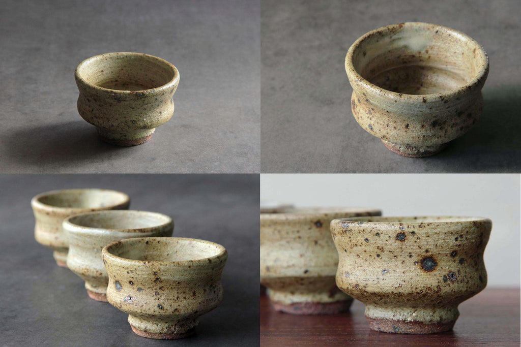 Set of Japanese ceramic sake cups with rustic glaze and
natural firing spots.