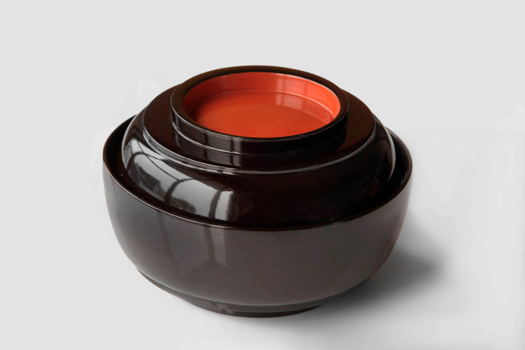Traditional Japanese urushi lacquer bowls with refined form and elegant finish.