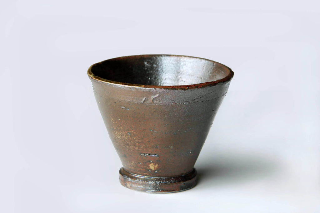 Single Kanayama pottery tea cup, flared shape with rough
yakishime surface.
