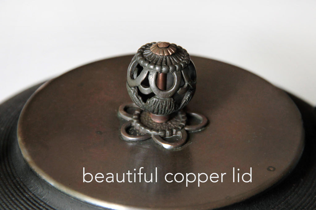 Top and bottom views of copper lid with
decorative finial for Japanese iron kettle