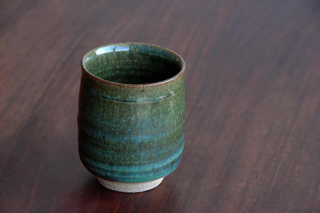 Green glaze tea cup. Japanese Agano pottery.