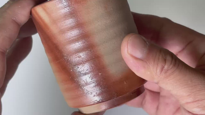 Rotating and close-up video showcasing the shape, texture, and details of the Bizen tea cip.