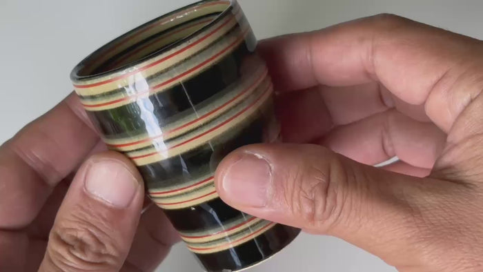 Rotating and close-up video showcasing the shape, texture, and details of the small cup.