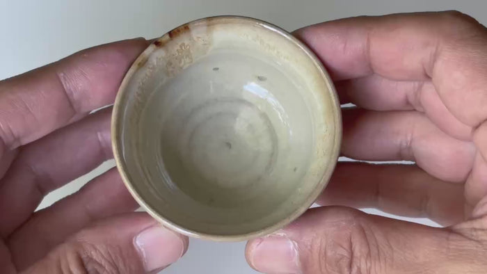 Rotating and close-up video showcasing the shape, texture, and details of the takatori yaki cup.