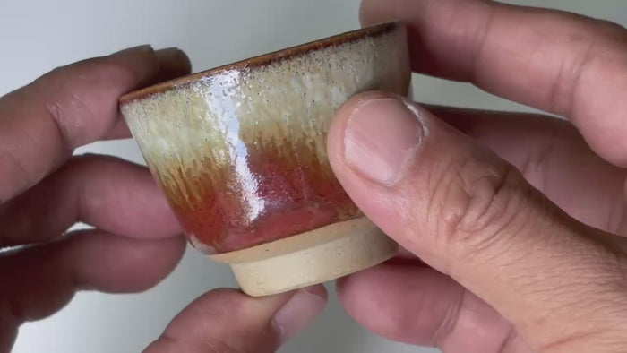 Rotating and close-up video showcasing the shape, texture, and details of the red cup.