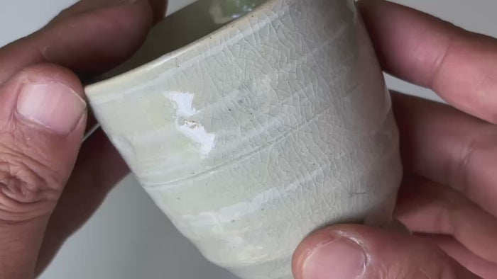 Rotating and close-up video showcasing the shape, texture, and details of the lidded tea cup.