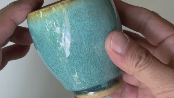 Rotating and close-up video showcasing the shape, texture, and details of the blue Otaru ware cup.