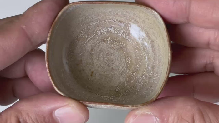 Rotating and close-up video showcasing the shape, texture, and details of the unique shape small cup.