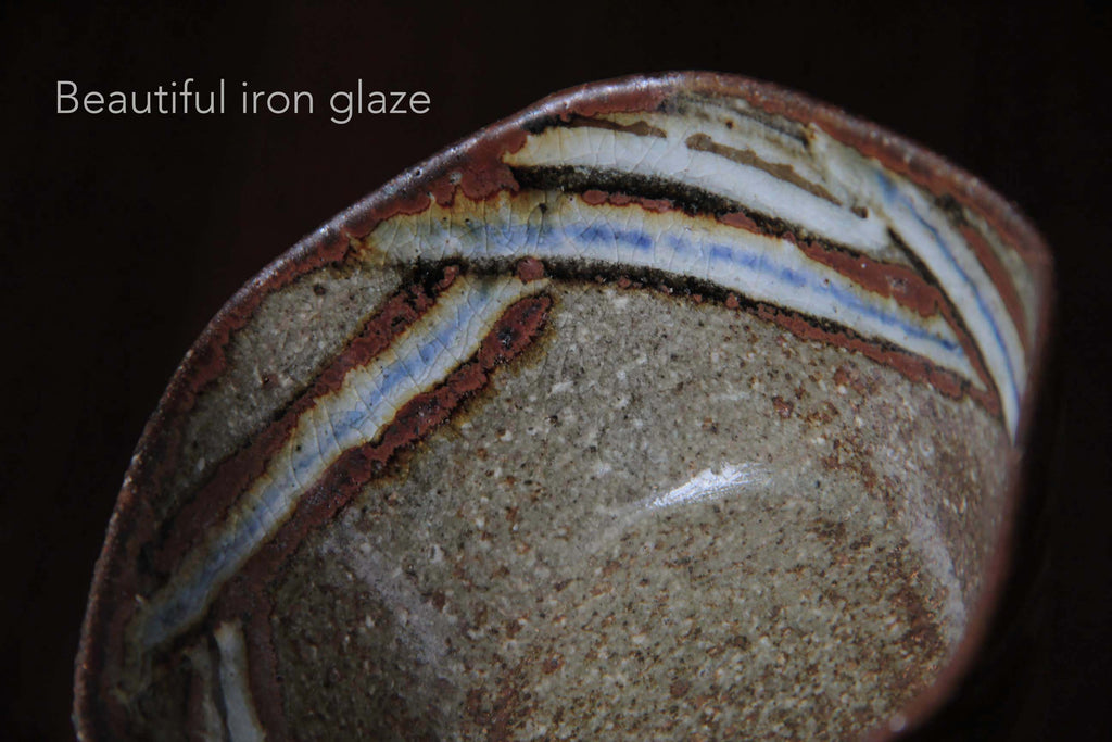 Hexagonal Japanese pottery bowl with iron and ash glaze