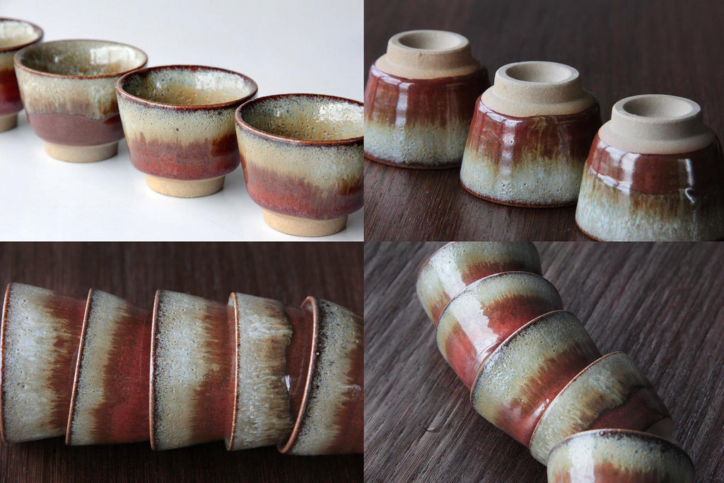 Stacked arrangement of Japanese ceramic cups showing color variation.