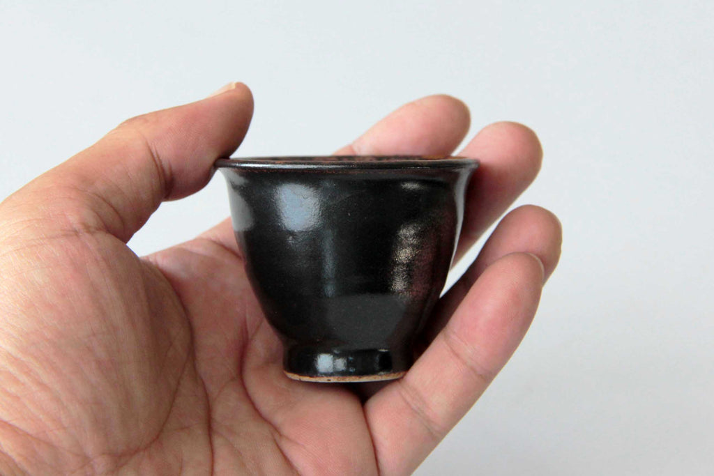 Satsuma yunomi cup held in hand to show scale and ergonomic shape