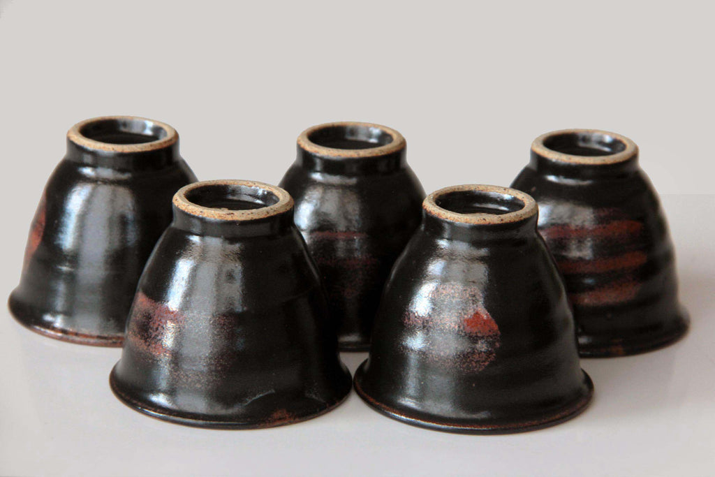 ive upside-down Satsuma yunomi cups displaying foot details and varied firing patterns