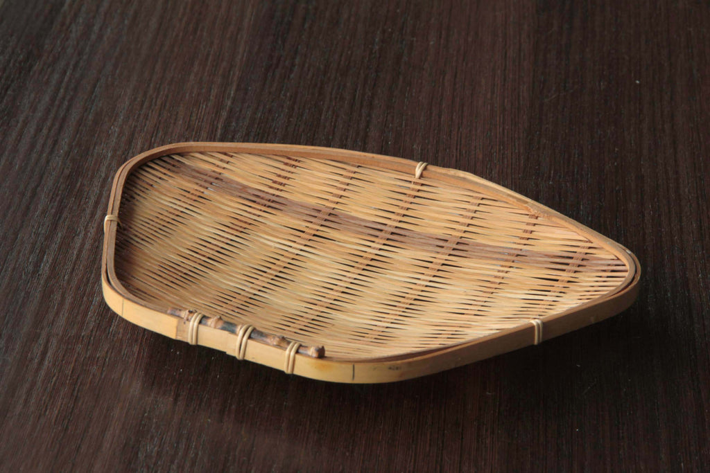 Single bamboo tray displayed on a wooden surface showing natural texture and finish