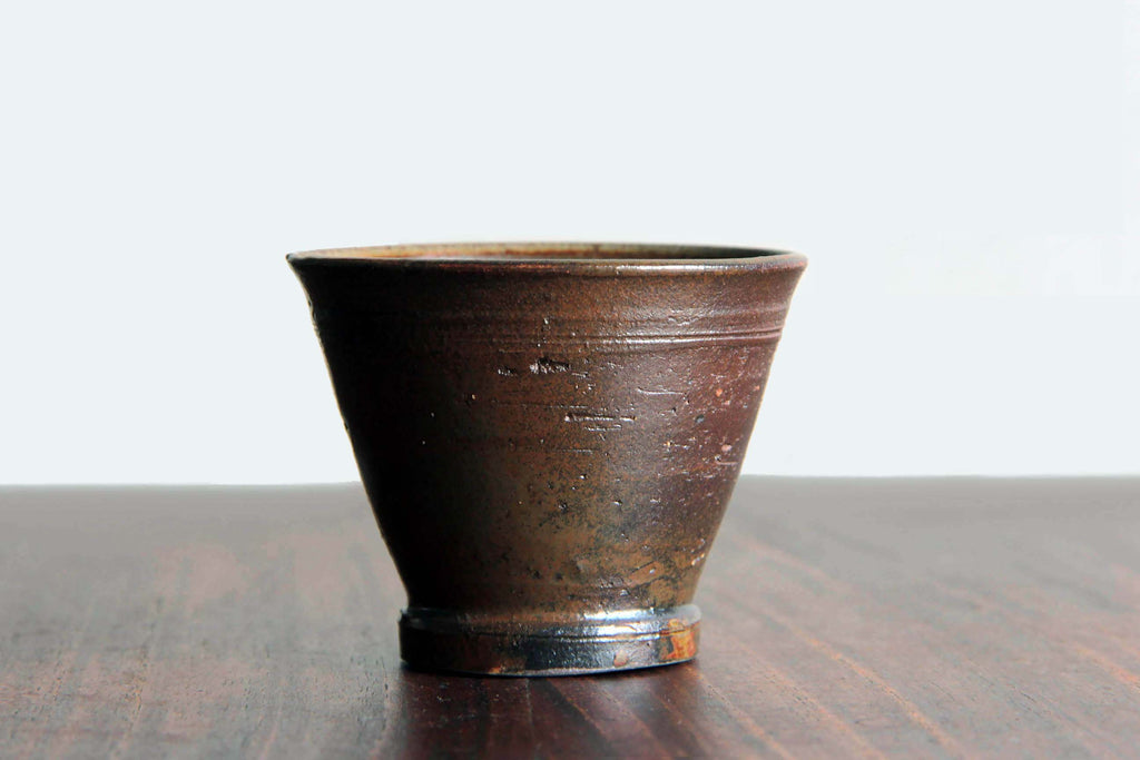 Side profile of Kanayama yakishime cup, reddish-brown
clay and unglazed texture.